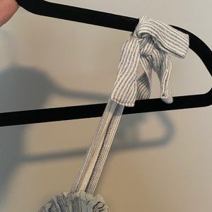 Small jump suit with adjustable shoulder ties